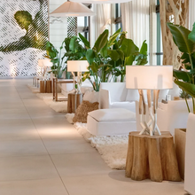 Load image into Gallery viewer, Modern interior design with white furniture, potted plants, and pendant lights.