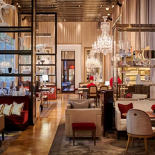 Load image into Gallery viewer, Baccarat hotel lounge crystal chandeliers, elegant and comfortable seating area with crystal and glass decor
