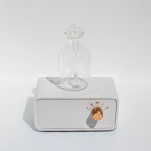 Load image into Gallery viewer, Glass Urn room scent diffuser on a white base with a metallic nob