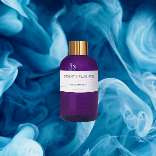 Purple bottle with gold cap on a blue and white smoke background, featuring 'Scent & Fluence' brand scent oil Holy Smokes.
