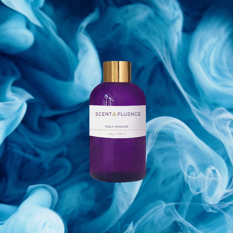 Purple bottle with gold cap on a blue and white smoke background, featuring 'Scent & Fluence' brand scent oil Holy Smokes.