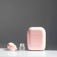 Load image into Gallery viewer, Scent pod personal scent diffuser in pink on a gray background and white table