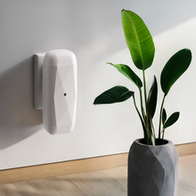 Load image into Gallery viewer, SMI DIamond scent diffuser wall plug in white. Vase with green plant fronds