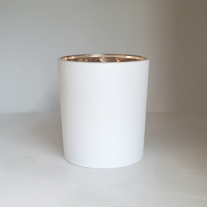 Child's Pose Yoga inspired 9oz soy candle by ScentFluence with cotton wick in a white frosted matte vessel and gold colored mirrored interior.